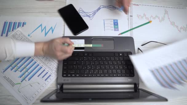 Two businessmen discuss company income analyze business charts - Felvétel, videó