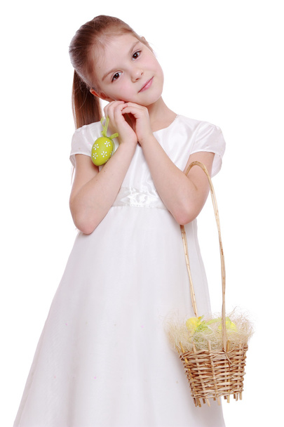 Girl holding a Easter basket - Фото, изображение