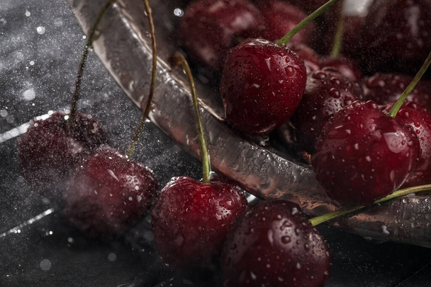 juicy ripe cherry close-up. Red cherry. macro photo. Still life on a dark background. - Photo, Image