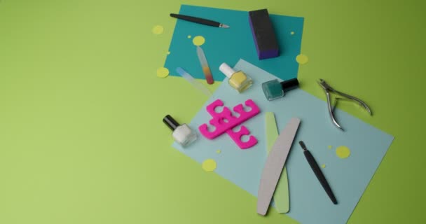 Set for manicure and pedicure on color background, video with stop motion effect - Πλάνα, βίντεο