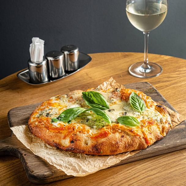 italian pizza on the wooden table - 写真・画像