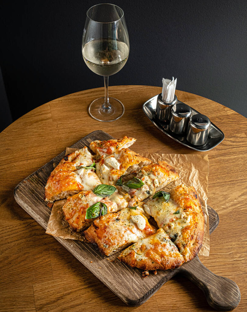 italian pizza on the wooden table - Valokuva, kuva