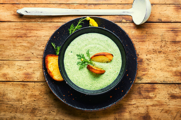 Puree soup, dietary zucchini and herb soup, garnished with croutons.Summer soup - Photo, Image