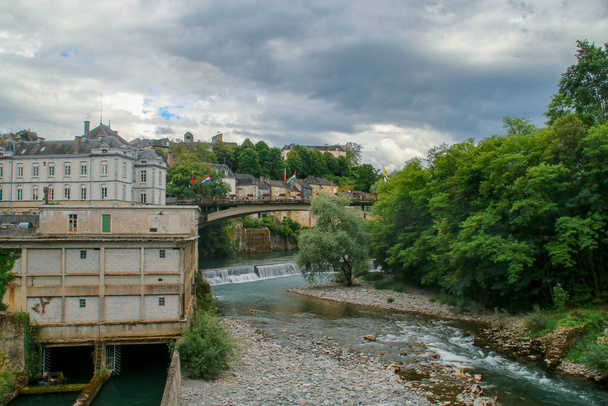 The river Aspe in Oloron-Sainte-Marie, France. Cityscape of the banks of the river that runs through the city. - Fotó, kép