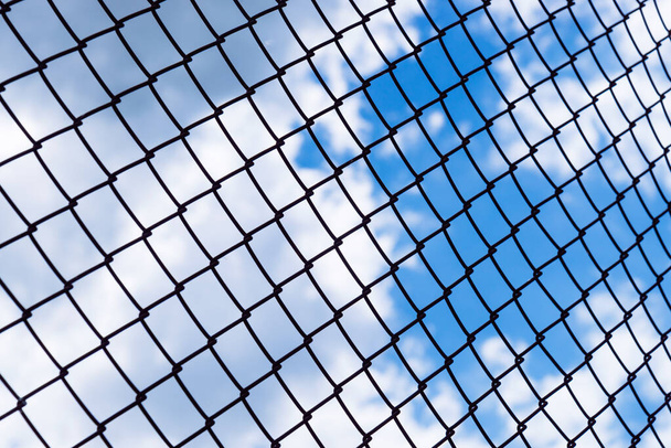Chain link fence and sky background. - Foto, immagini