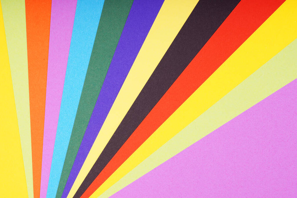 multicolored sheets of paper in fan-shaped pattern background - 写真・画像