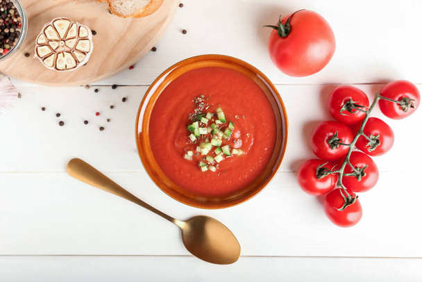 Bowl with tasty gazpacho on light wooden background - Foto, Imagen