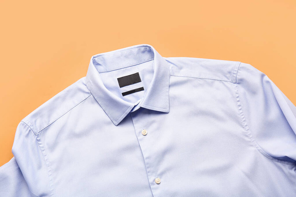 Stylish male shirt on color background - 写真・画像