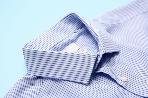 Stylish male shirt on color background, closeup - Foto, Imagen