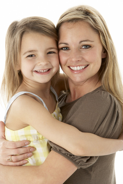 Studio Portrait Of Mother Hugging Young Daughter - Photo, Image