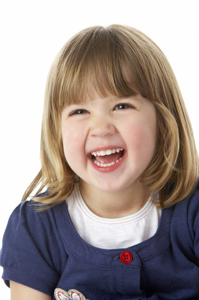 Studio Portrait Of Laughing Young Girl - 写真・画像