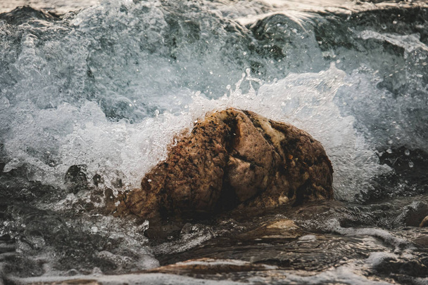 A closeup shot of a rocky shore for wallpaper and background - Valokuva, kuva