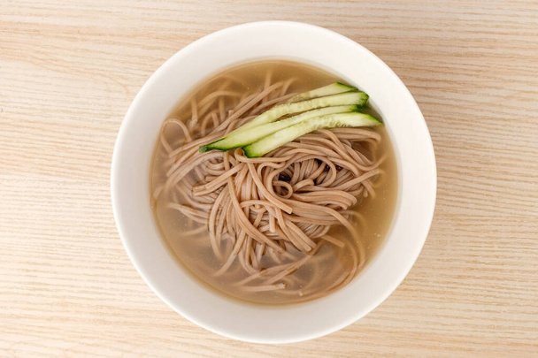Cold noodles with buckwheat noodles. Cold soup. Korean food in summer - Foto, imagen
