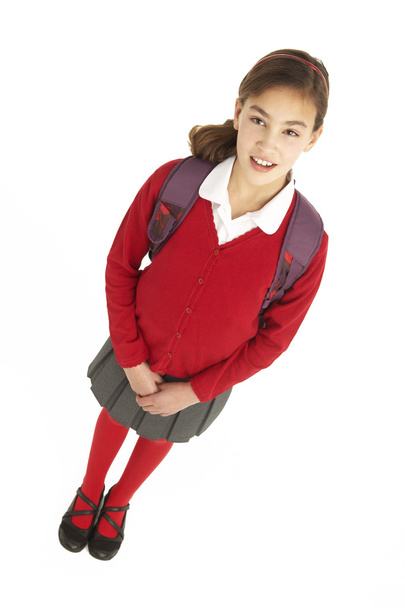 Studio Portrait Of Female Student In Uniform With Backpack - Фото, изображение
