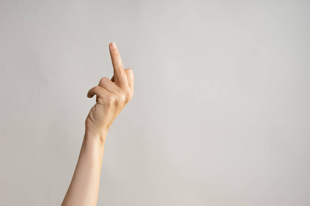 Hand gestures. Middle finger, aggressive gesture. Womens hand - Foto, Imagem