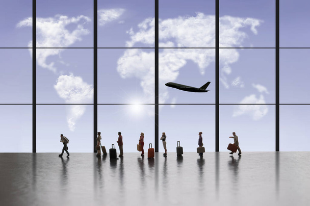Miniature people in queue at airport terminal with cloud map of world through window  - Φωτογραφία, εικόνα