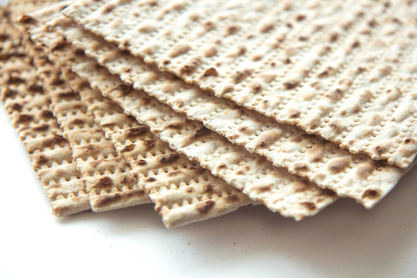 Traditional Jewish kosher matzo for Passover. Set with Passover matzos on white background. Pesach celebration - Photo, Image