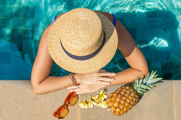 European woman with hat in the pool, view from above. Summer concept. - Foto, Imagem