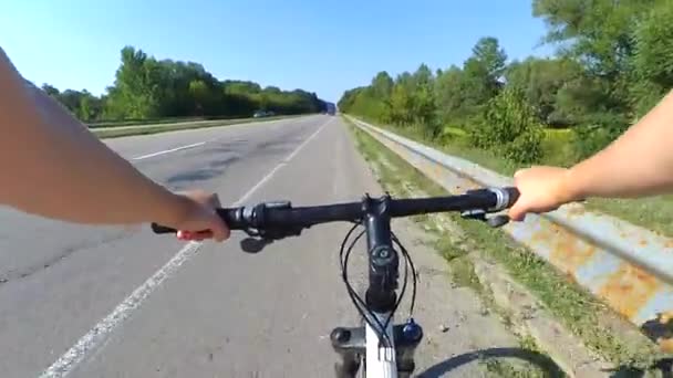 cyclist on a bike rides the freeway - Footage, Video