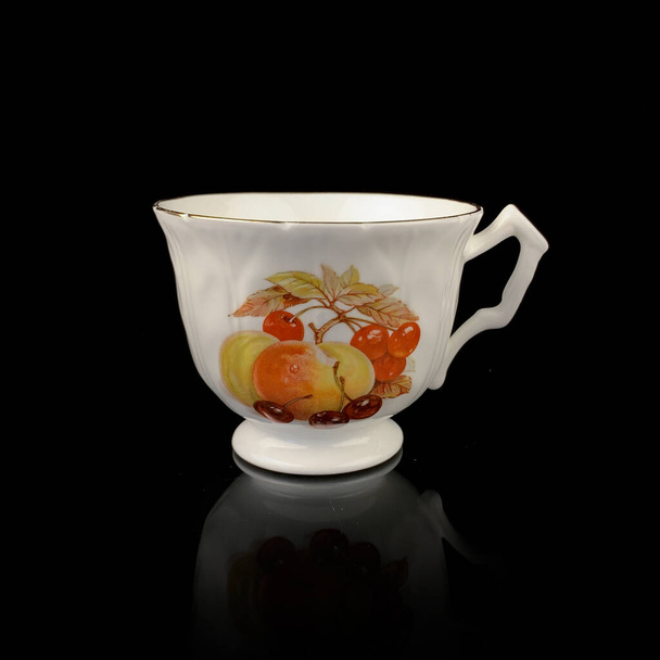 vintage antique hand painted cup on black isolated background - Photo, Image