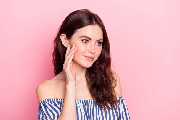 Photo of nice optimistic brunette lady look empty space wear blue dress isolated on pastel pink color background - Фото, изображение