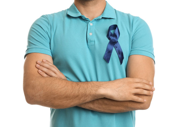 Man with blue ribbon on white background, closeup. Urology cancer awareness - Fotografie, Obrázek
