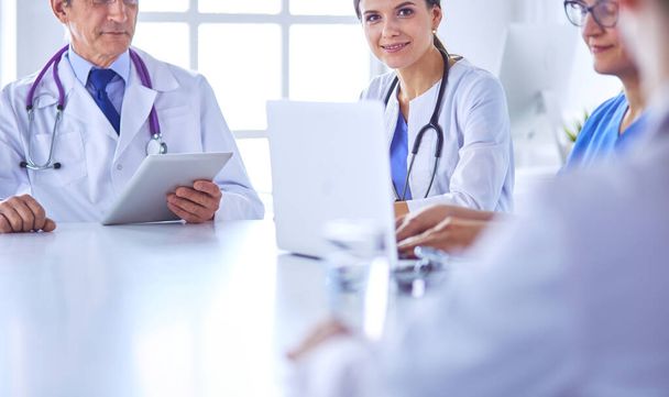 Doctors consulting with each other in a hospital conference room - Photo, image