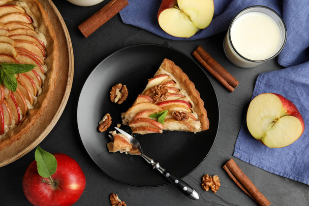 Delicious apple pie served on black table, flat lay - Photo, Image