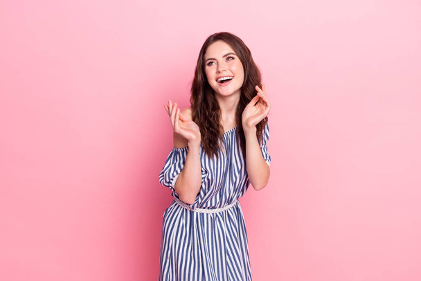 Photo of nice optimistic brunette lady look empty space wear blue dress isolated on pink color background - Фото, изображение