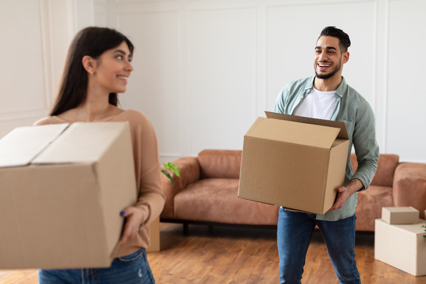 Happy man and woman holding cardboard boxes - Photo, Image