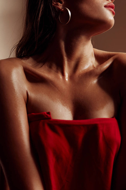 Portrait photo of a young hot hispanic girl. With crisp cheekbones. dressed in a red dress - Φωτογραφία, εικόνα