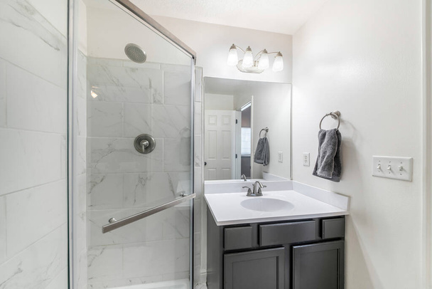 Bathroom interior with vanity sink and corner shower stall - Photo, Image