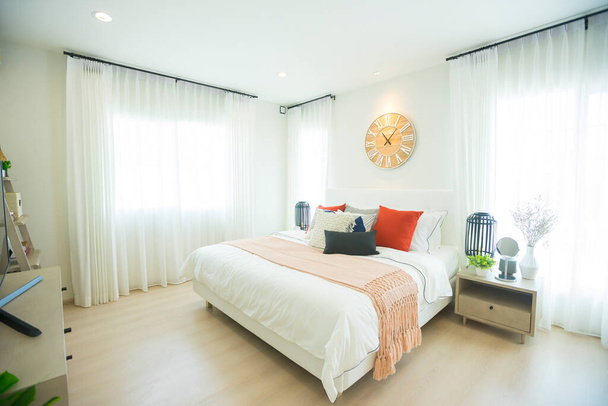 interior of a modern bedroom with a clock on the wall - Photo, Image