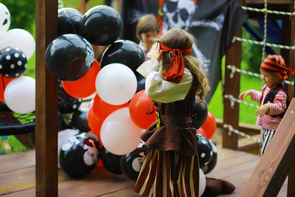 Children's party in pirate style. Children in pirate costumes are playing on Halloween. - Photo, Image