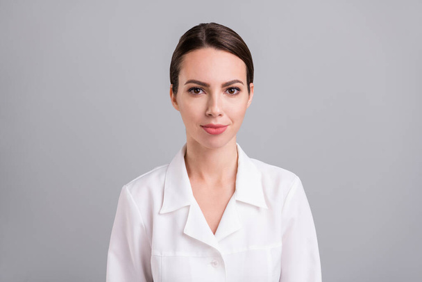 Photo of adorable pretty young doc woman dressed white coat smiling isolated grey color background - Valokuva, kuva