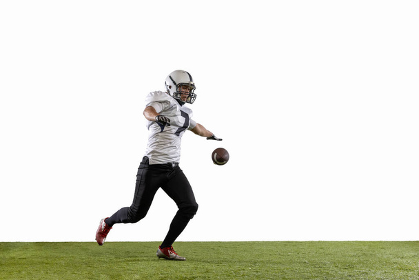 American football player isolated on white studio background. - Foto, imagen