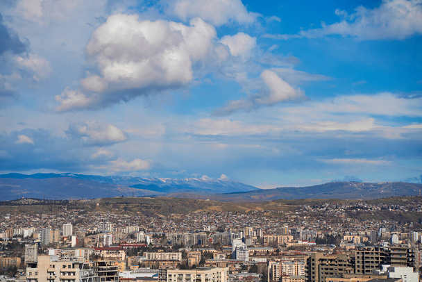 Panorama of a densely populated city. Tbilisi city landscape from above. - Fotografie, Obrázek