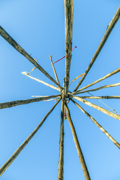 Tipee stakes and ribbons shown against a blue sky  - Photo, Image