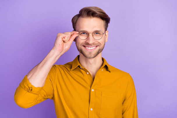 Portrait of attractive content cheerful guy wearing touching specs isolated over violet purple color background - Valokuva, kuva