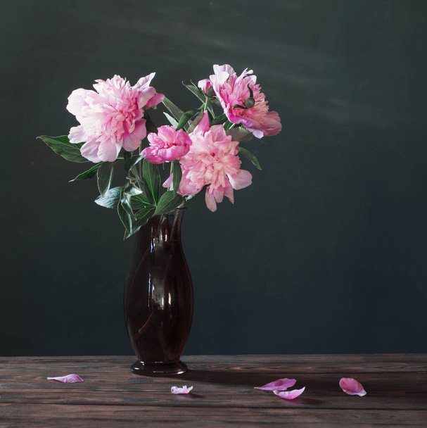 pink peony in  vase  on background dark wall - Фото, зображення