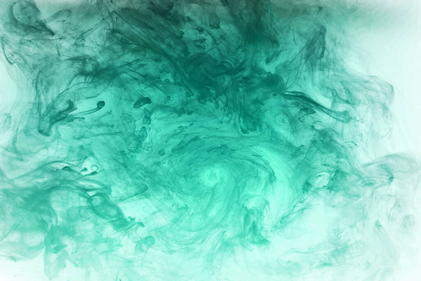 Abstract blue-green ocean, paint in water background. swirl of splashes and waves in motion. Fluid art wallpaper, liquid vibrant colors - Photo, Image
