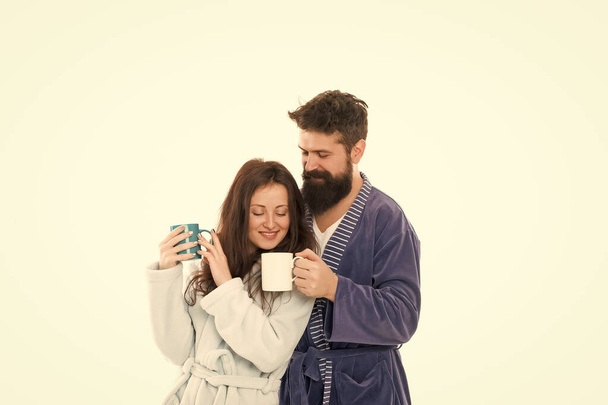 couple in love wear bathrobe. family day at home. Couple enjoy lazy weekend and drink coffee. man and woman need relax and energy. everyday routine. good morning coffee. happy family drink tea - Foto, imagen