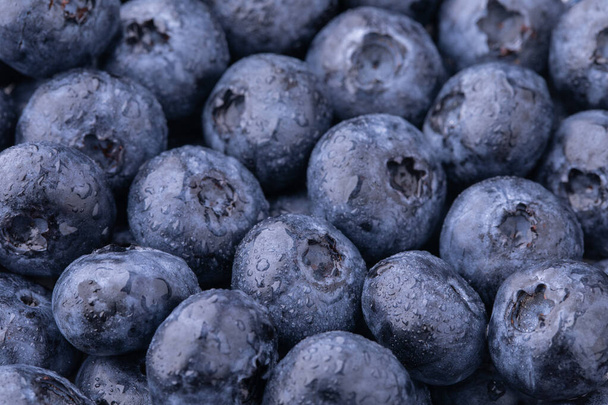 Blueberries closeup with water drops, blueberries background, food background - Fotó, kép