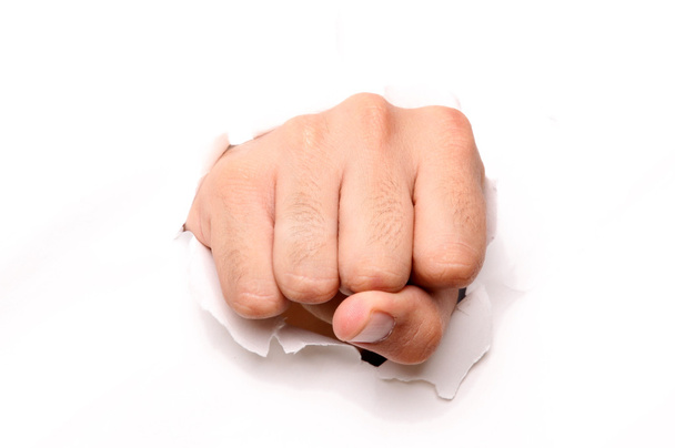 hand ponsen door papier geïsoleerd ove witte achtergrond - Foto, afbeelding