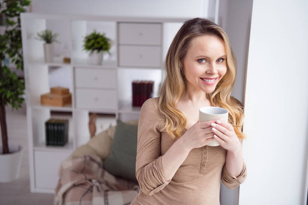 Photo of young attractive woman happy positive smile enjoy morning cup of hot coffee break pause home - Фото, зображення