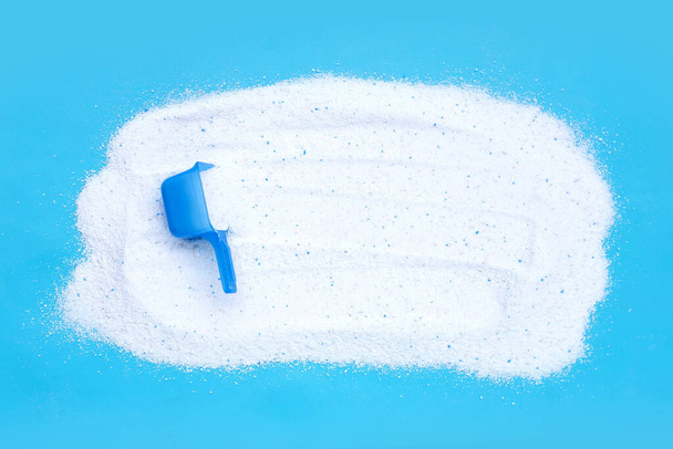 Detergent powder with measuring spoon for clothes washing. Laundry concept. - Fotografie, Obrázek