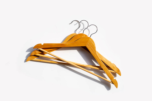 Wooden clothes hangers on white background - Photo, Image