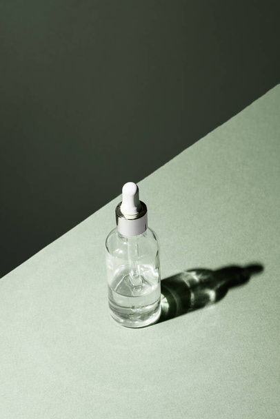 Dropper glass Bottle Mock-Up. Body treatment and spa. Natural beauty products. Eco cream, serum, skin care blank bottle. Anti-cellulite massage oil. Oily cosmetic pipette - Photo, image