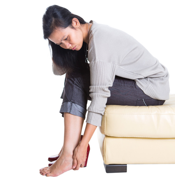 Asian Female Rubbing Hurt Heel - Foto, Imagen