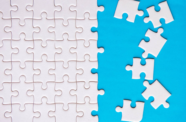 Jigsaw puzzle white color,Puzzles pieces grid,Success mosaic solution template,Horizontal on blue color background copy space for text,Top view - Fotó, kép